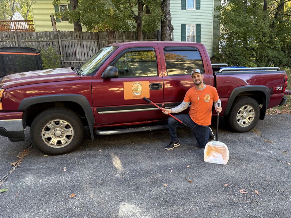 Mark with his Heavy Doody Scoops truck, marked with the company logo and Leominster phone number