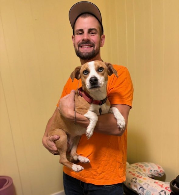 Mark Smith, owner of Heavy Doody Scoops, holding his dog Lissy